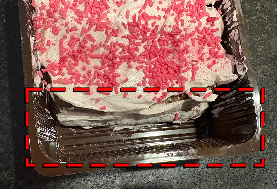 Cake in pan showing a missing row of Lady Fingers