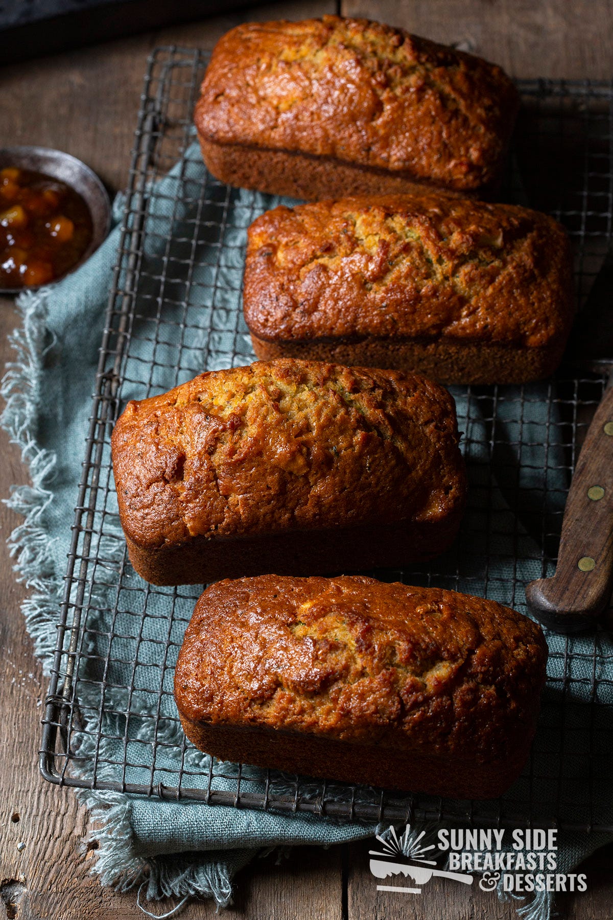 Four loaves of apple carrot zucchini bread.