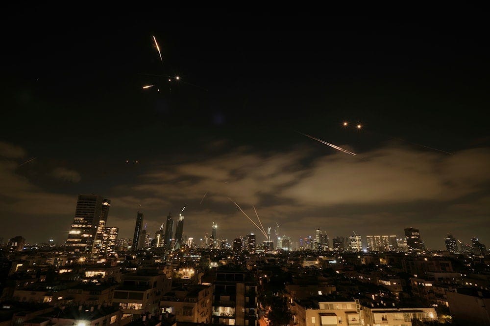 The Israeli Iron Dome air defense system fires to intercept missiles over Tel Aviv, Occupied Palestine, Sunday, June 15, 2025 (AP) The Israeli Iron Dome air defense system fires to intercept missiles over Tel Aviv, Occupied Palestine, Sunday, June 15, 2025 (AP)