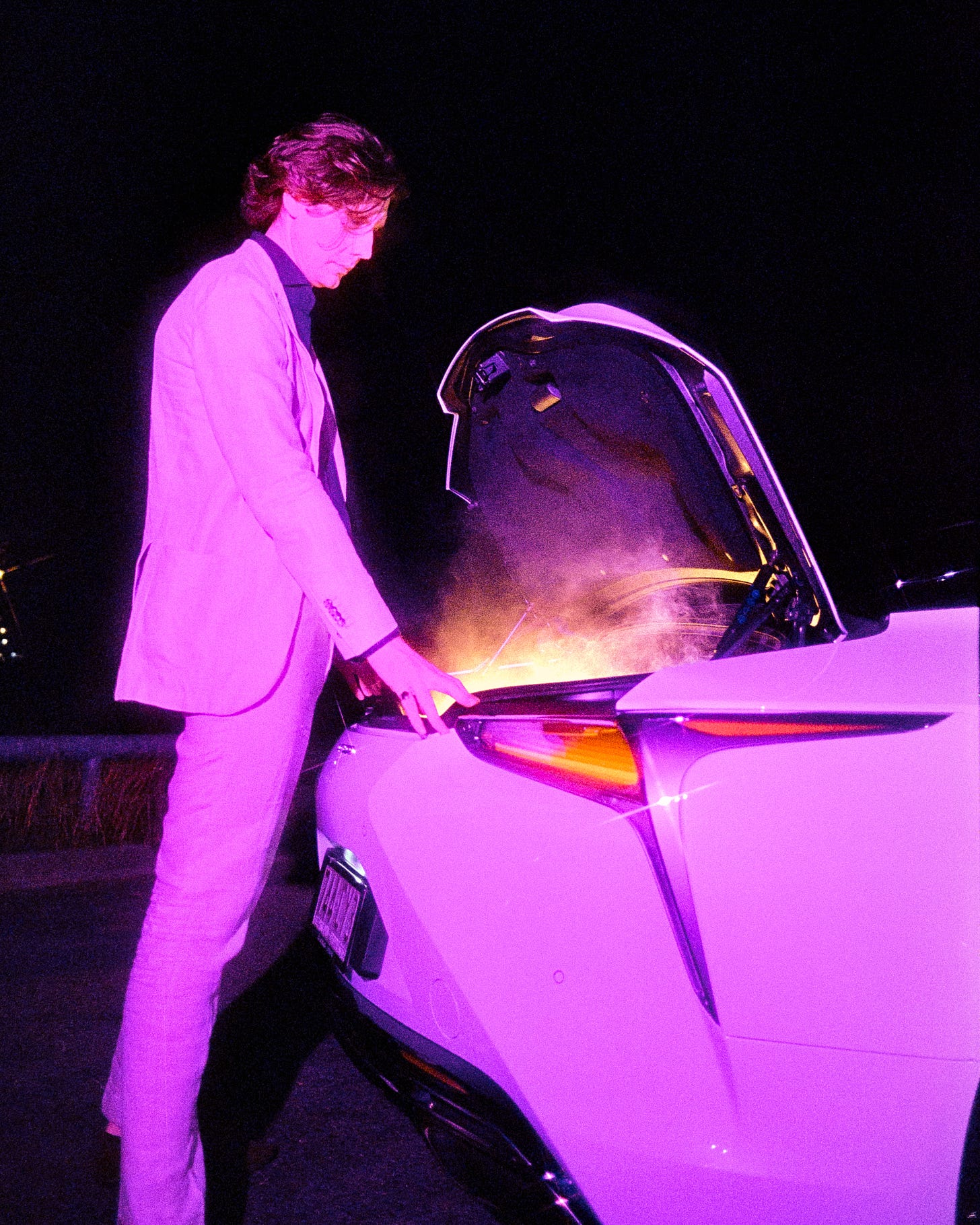 A very pink/purple image of Clem opening the boot of his car to reveal a puff of smoke