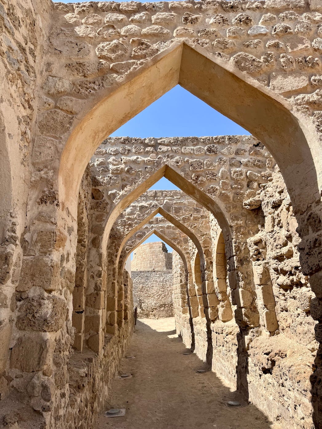 old gate at Bahrain Fort, The Qal'at al-Bahrain, an archaeological site in Bahrain