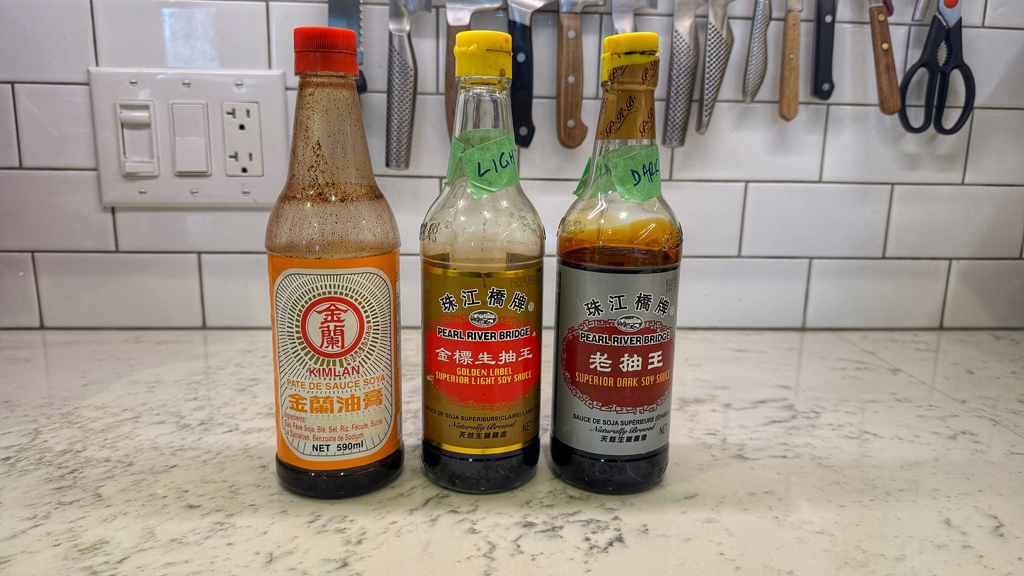 Just the three Chinese soy sauces I won arranged side by side on a kitchen counter