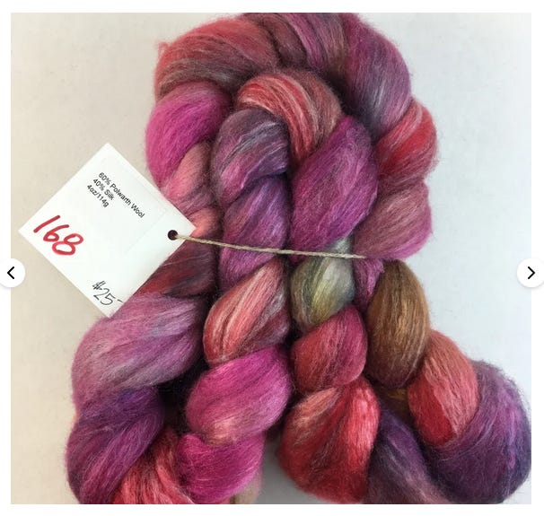 Polwarth wool and silk blended together and dyed spring red pink purple and a little bit of blue-green