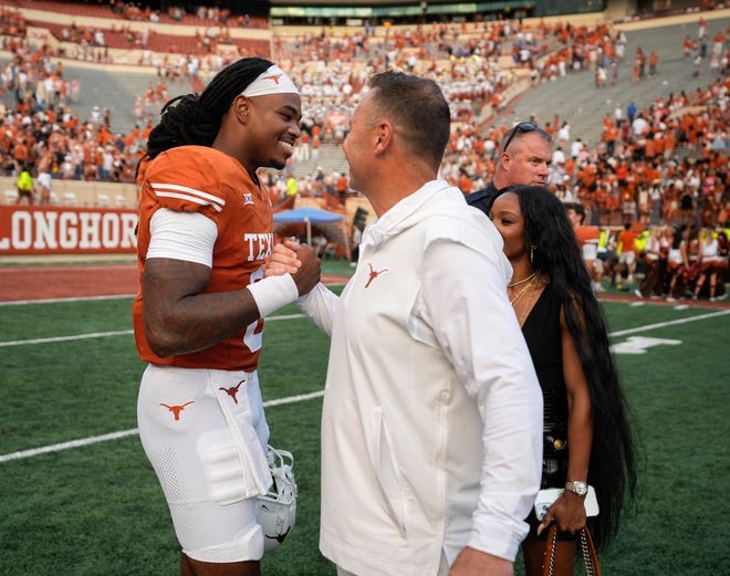 Texas head coach Steve Sarkisian congratulates quarterback Maalik Murphy after the Longhorns' 35-6 win on Saturday over BYU. Murphy is expected to make his second college start this week at home against No. 25 Kansas State; regular starter Quinn Ewers is still considered week-to-week with a sprained shoulder.