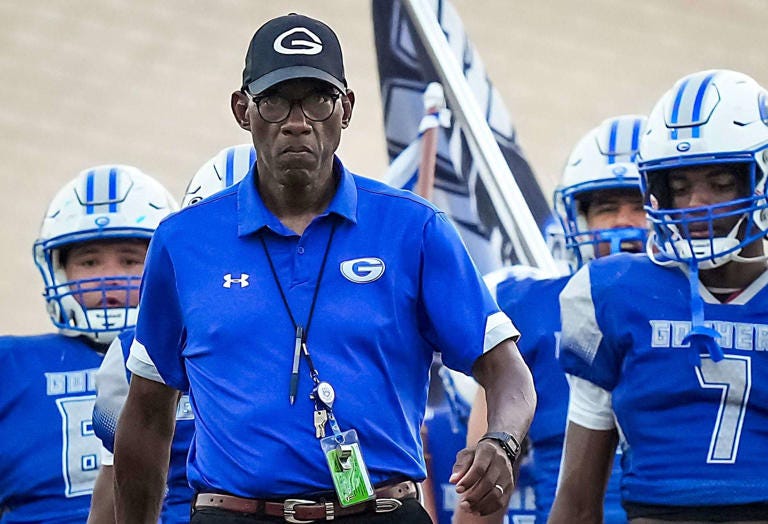 Grand Prairie head coach Tony Tademy leads his team as they prepare to take the field for a high school football game against Wylie East at the Gopher-Warrior Bowl on Thursday, Aug. 31, 2023, in Grand Prairie.