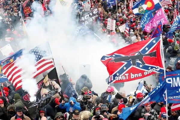 Jan 6 violence with smoke and Confederate flag flying