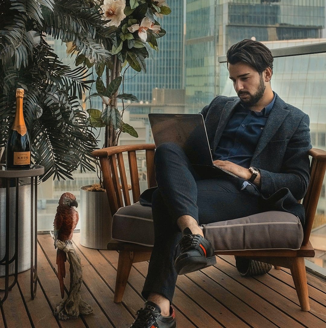man sitting beside side table