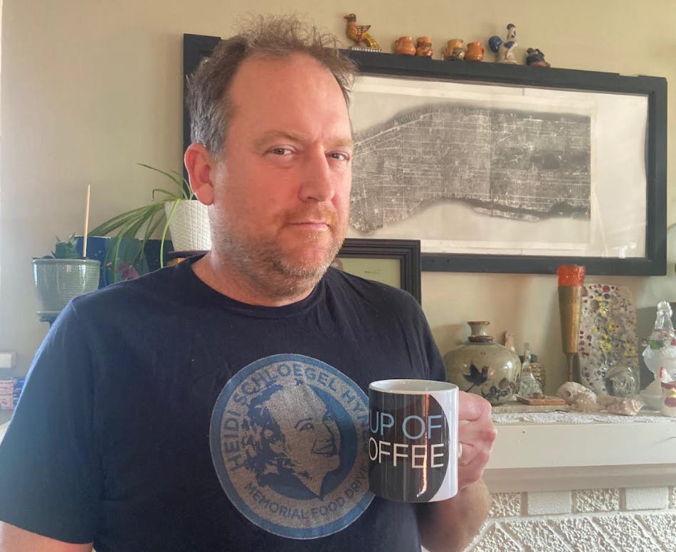 Subscriber Frank Schloegel holding a Cup of Coffee mug