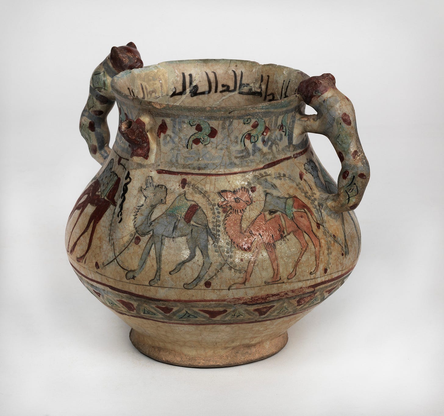 A vessel with painted decoration showing marching camels, with a Kufic inscription on the inside of the rim. From Rayy (Iran),  ca. 11th century CE.  Object NEP90. Courtesy of the Penn Museum.