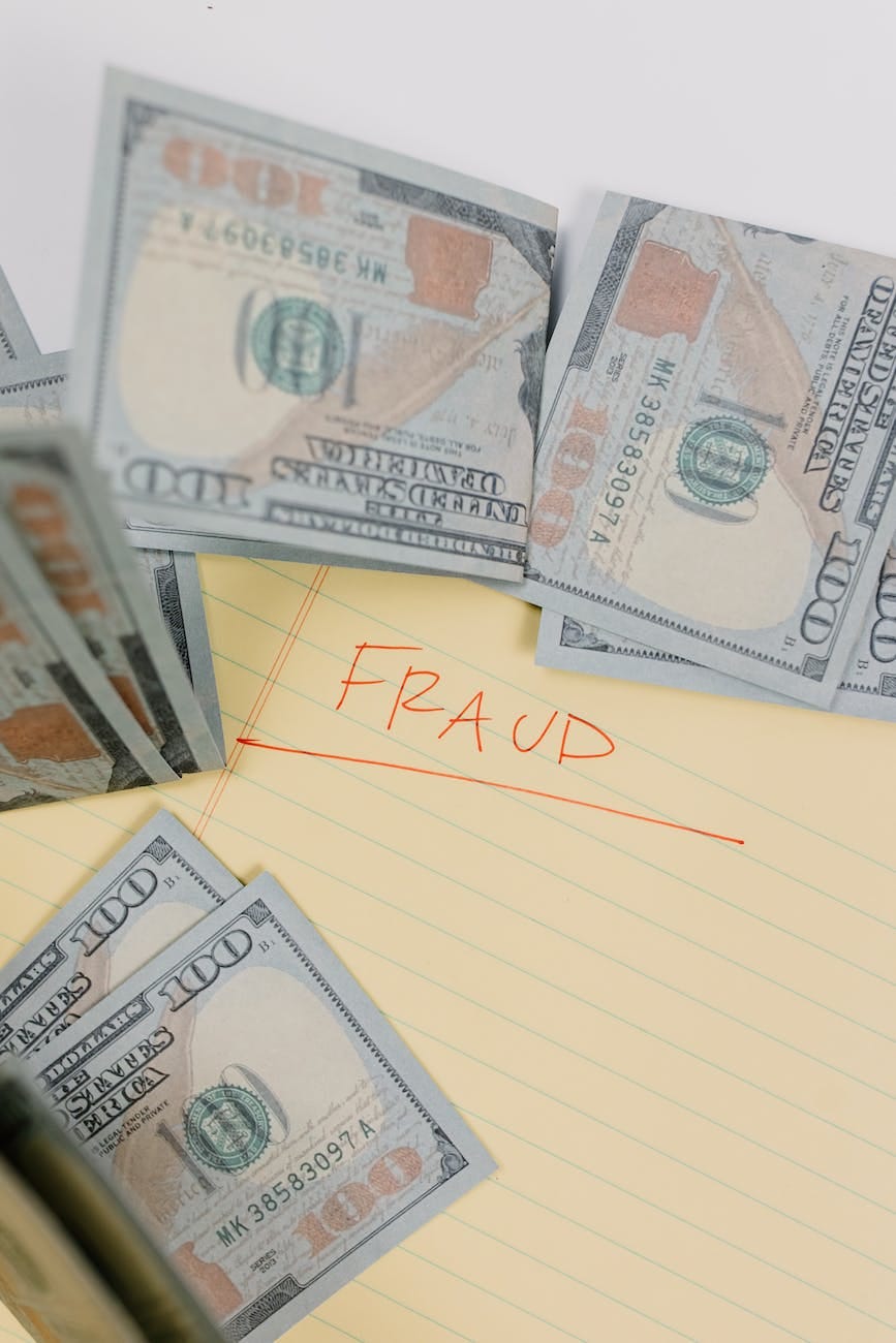 Image of United States Dollars with the Word 'Fraud'