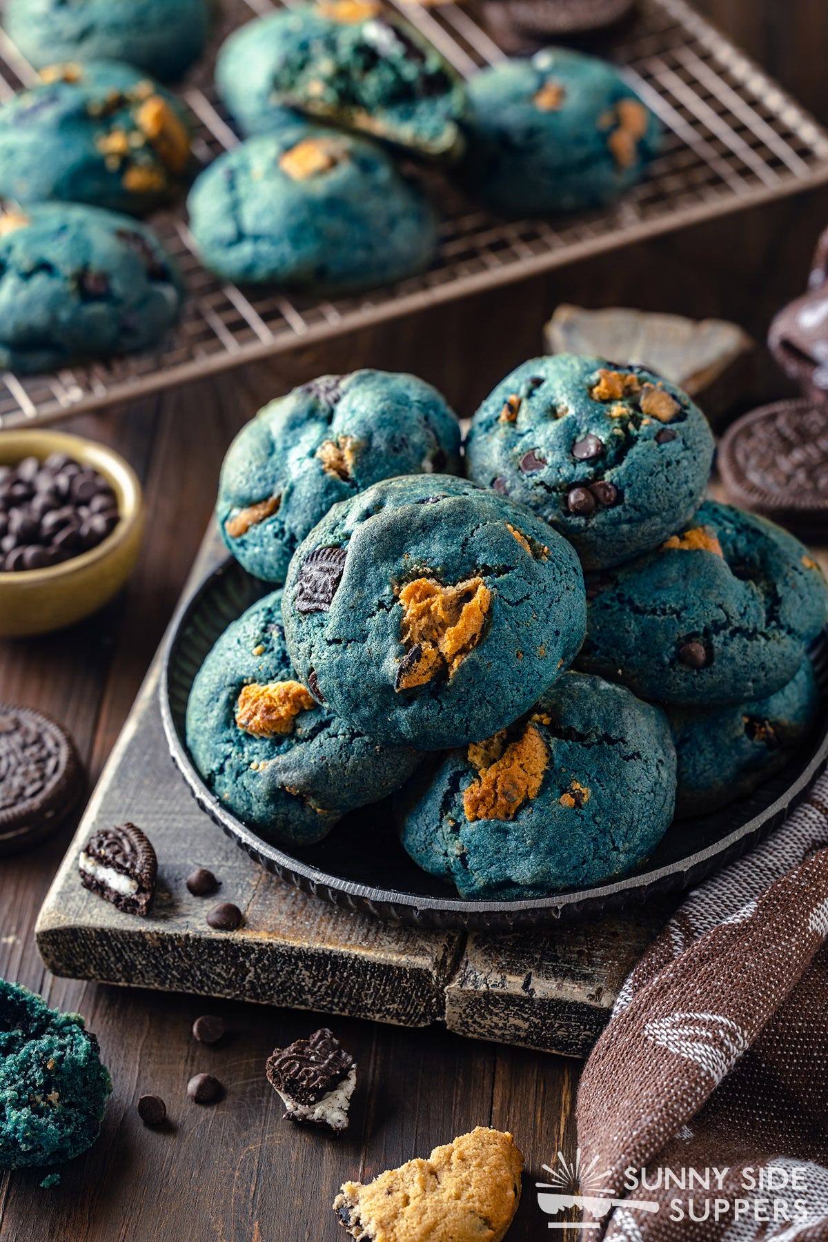 A plate full of blue monster cookies.