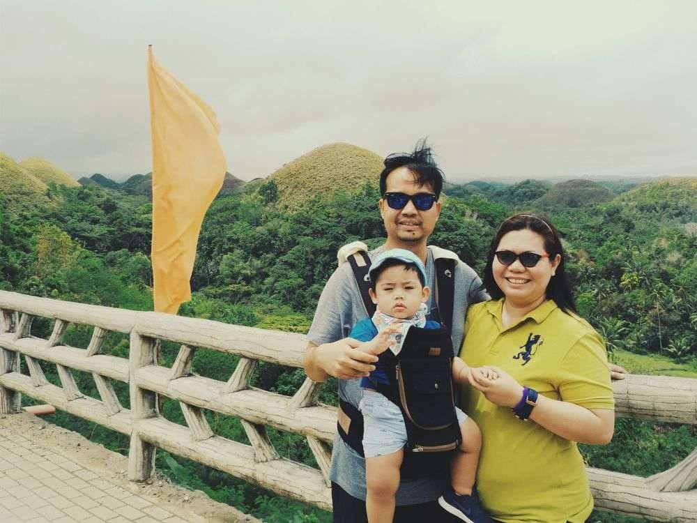 Mommy, Daddy, and Miguel with the Chocolate Hills at the background