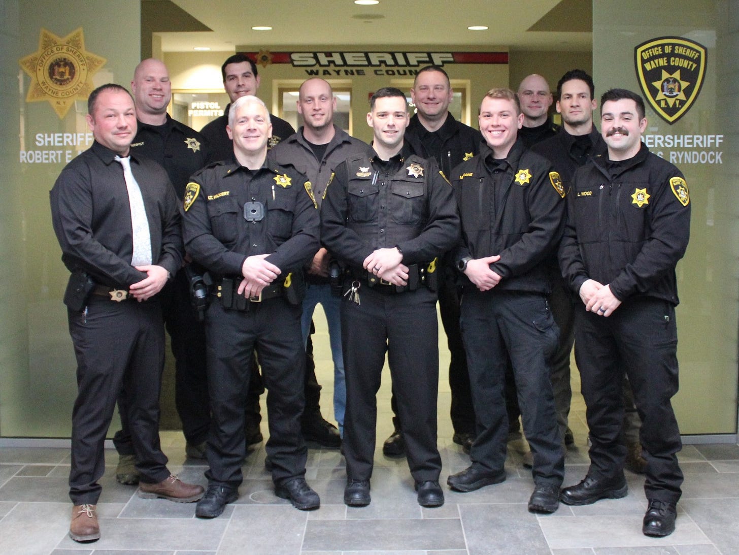 May be an image of 7 people, ambulance and text that says 'PISTOL SHERIFF SHERIFF ROBERT E WFICEESREATI WAYNE COUNTY OFFICEOF SHERIE cиaaT ERSHERIFF RYNDOCK'
