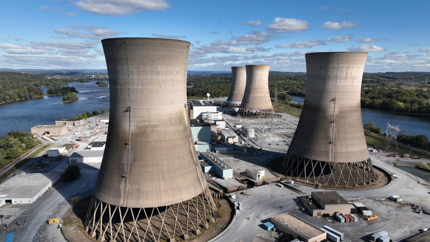 MIDDLETOWN, PENNSYLVANIA - OCTOBER 10: in this aerial view, the shuttered Three Mile Island nuclear power plant stands in the middle of the Susquehanna River on October 10, 2024 near Middletown, Pennsylvania. The plant’s owner, Constellation Energy, plans to spend $1.6 billion to refurbish the reactor that it closed five years ago and restart it by 2028 after Microsoft recently agreed to buy as much electricity as the plant can produce for the next 20 years to power its growing fleet of data centers. The