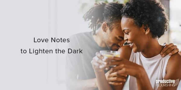 Black male and female couple smiling and hanging out. Text overlay: Love Notes to Lighten the Dark