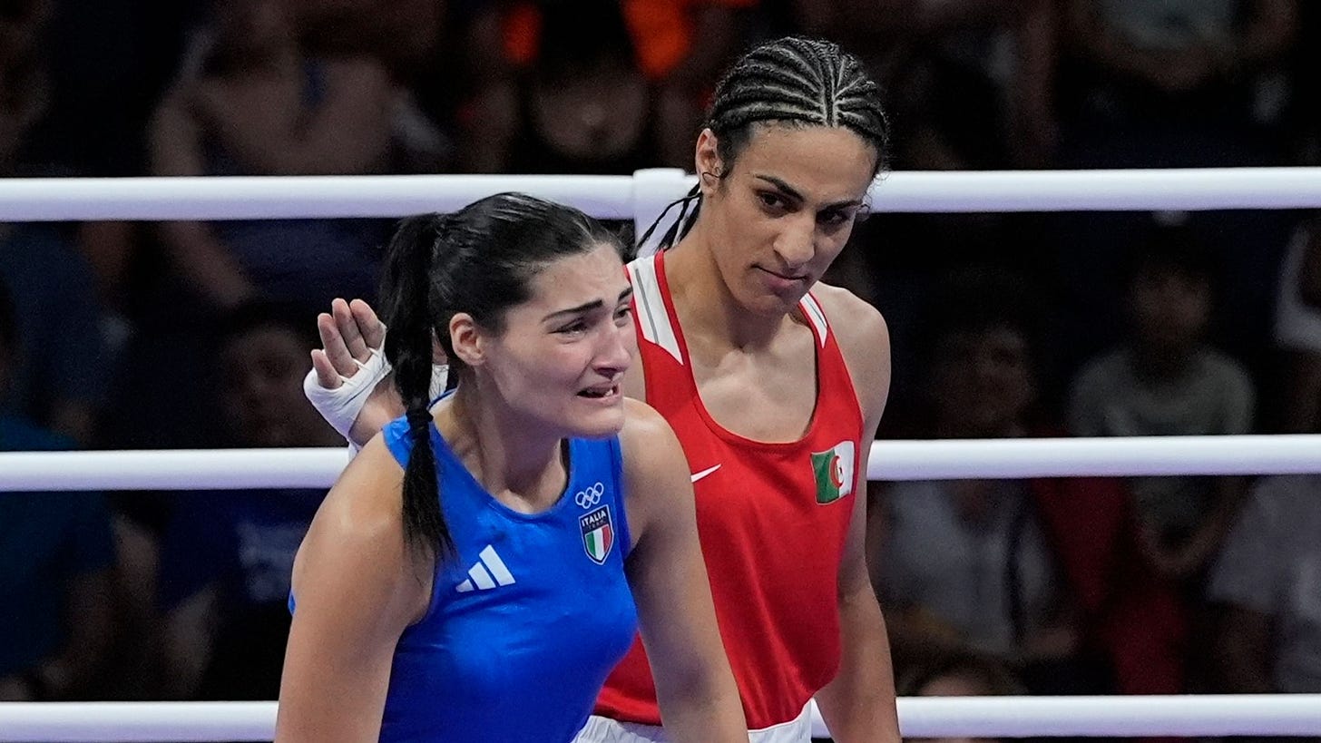 Imane Khelif pats a crying Angela Carini on the back after their Oympic boxing match