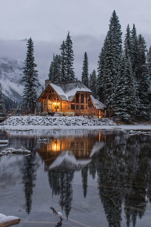 Cottage beside a lake in winter.