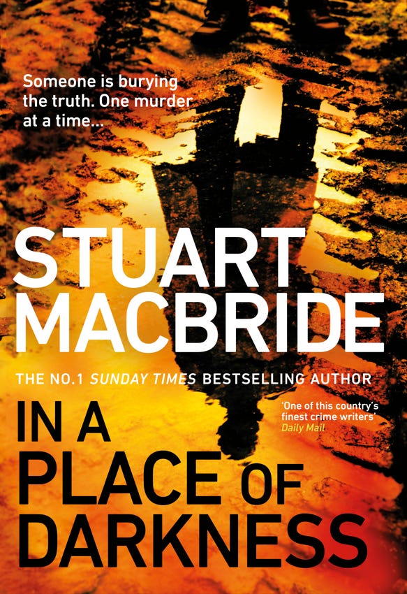 Cover for Stuart's book: In A Place Of Darkness