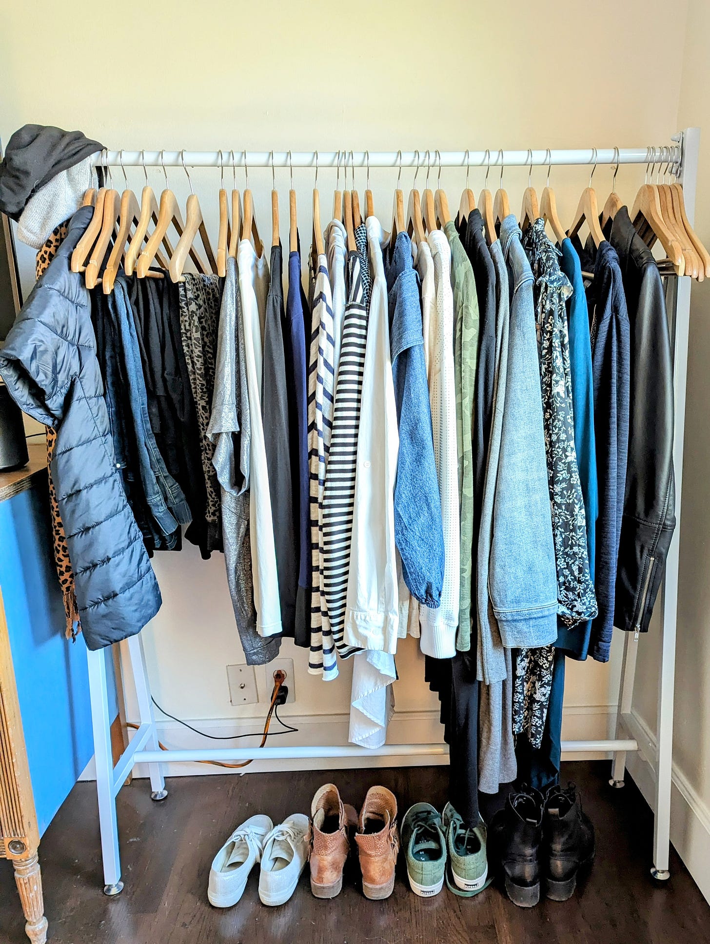 clothing rack with a winter capsule wardrobe of about 40 items
