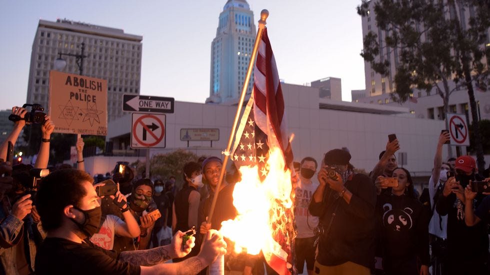 Demonstrators burn flag in downtown Los Angeles to protest death of George Floyd | The Hill