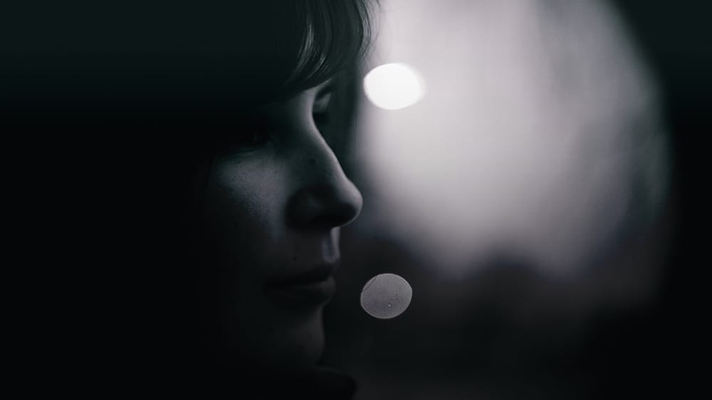 Shadowy profile of a woman's face