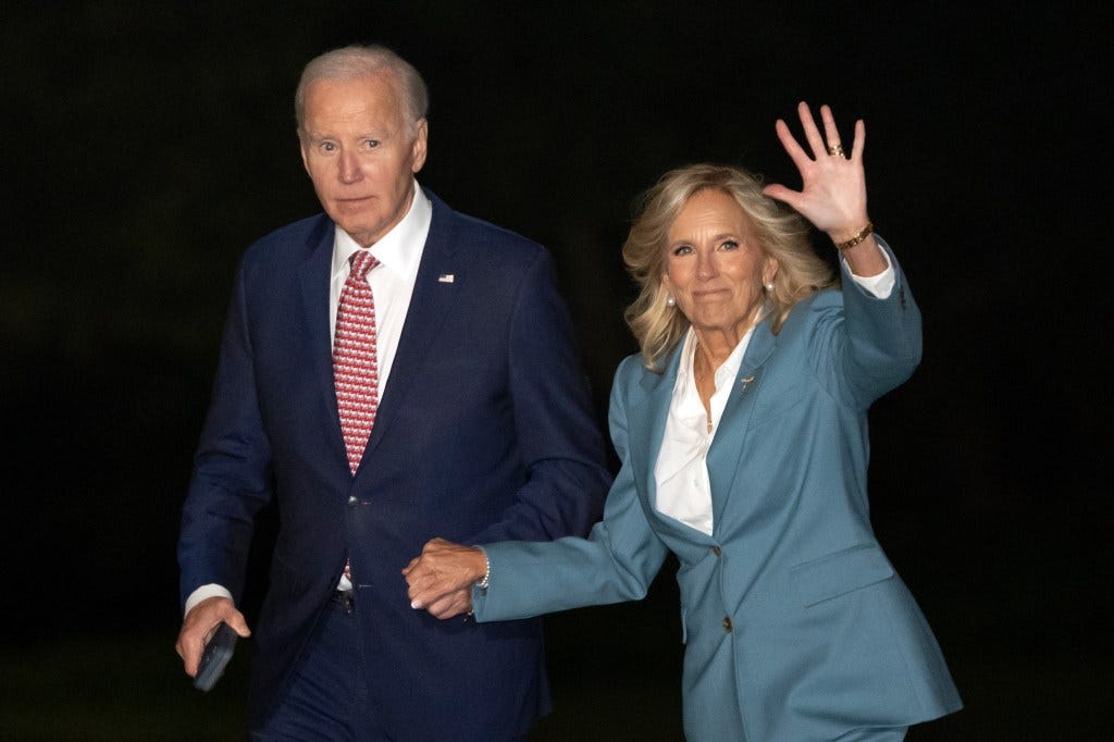 President Joe Biden and first lady Jill Biden walk across the South Lawn of the White House, Tuesday, Oct. 15, 2024, in Washington, after returning from a trip to Pennsylvania