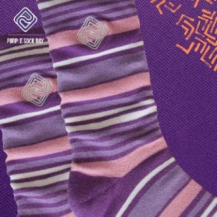 A pair of purple and white striped socks

Description automatically generated