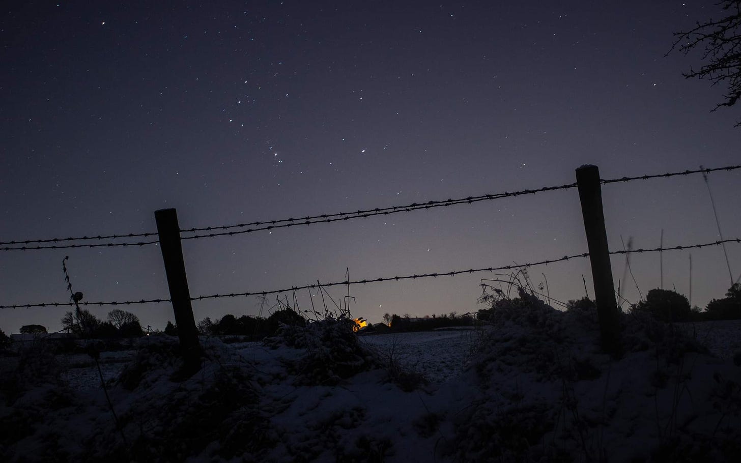 A Barbed Wire Fence on a Snowy Night : r/pics