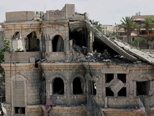 A view of a damaged residential building after impact from missiles fired from Iran, in Tamra, Sunday.
