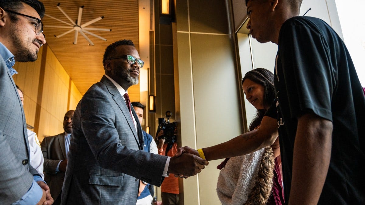 Mayor Brandon Johnson and Ald. Byron Sigcho Lopez (25th) briefly met with the migrants housed who are seeking shelter at the 12th District police station on the Near West Side on May 16, 2023. From Colin Boyle at Block Club Chicago.