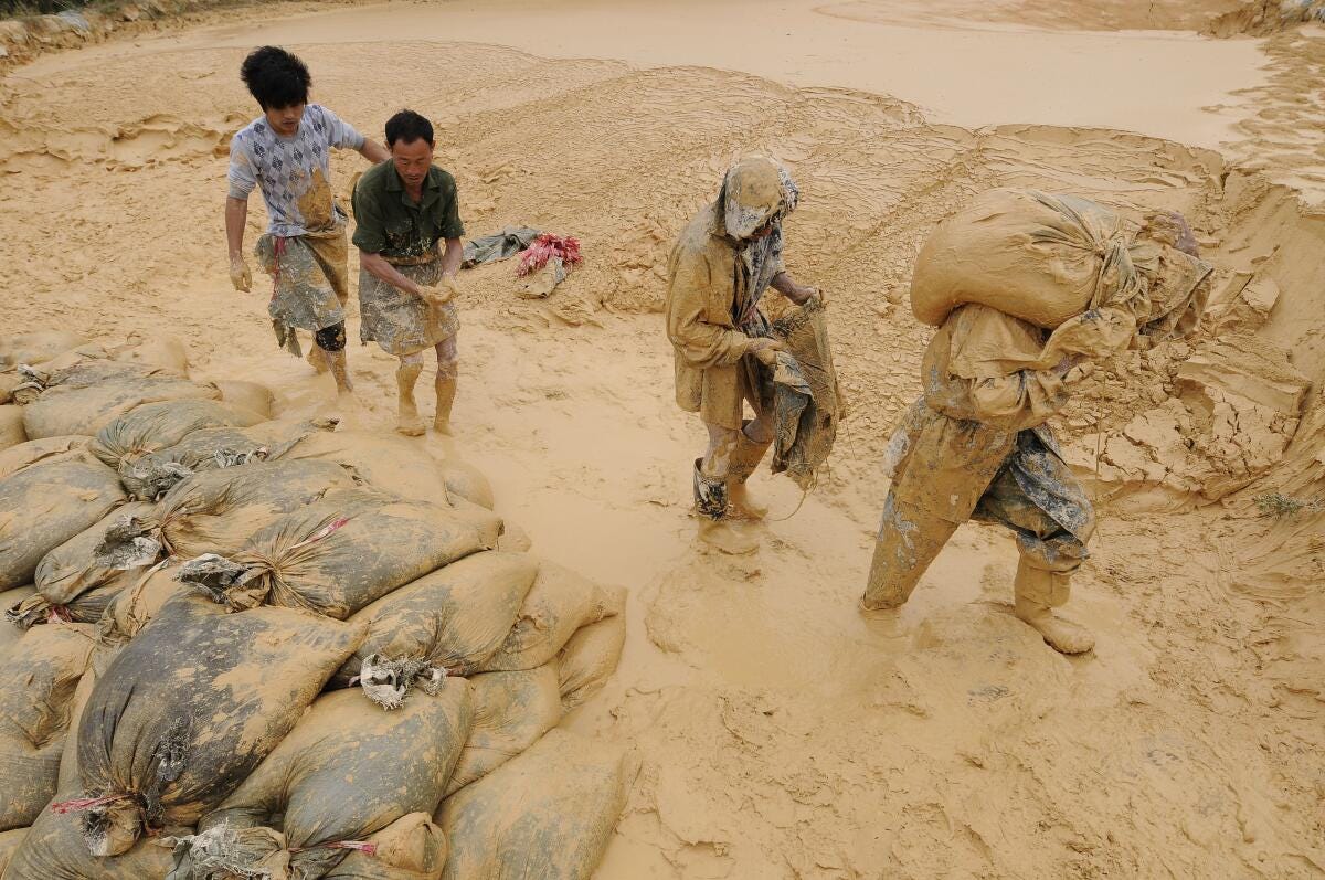 Laborers work at the site of a rare-earth mine at Nancheng county in Jiangxi province, China.