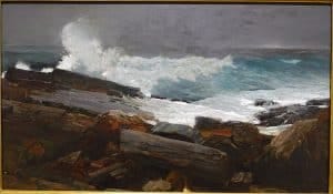 oil painting of dark rocks and a grey sky with ocean waves crashing up against the rocks showing white foam