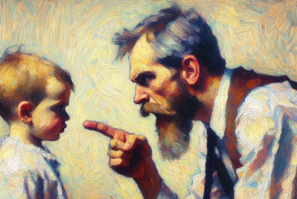 Father pointing an angry finger at a young child