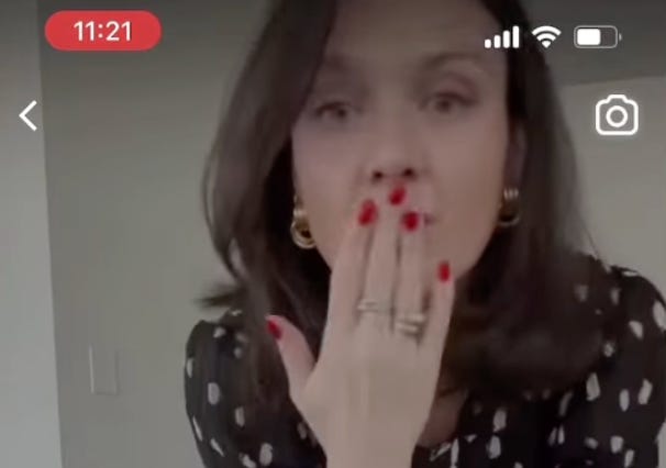 Doge employee Mclaurine Pinover blows a kiss at the camera