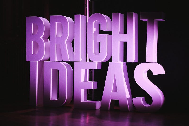 A 3D logo in purple spelling out Bright Ideas