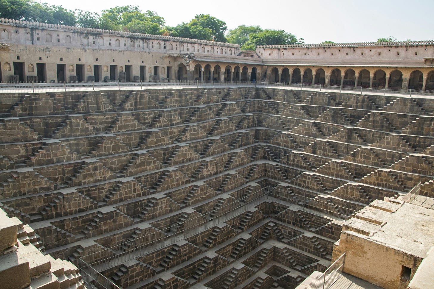 Chand Baori, a stepwell in the village of Abhaneri. Chand Baori consists of 3,500 narrow steps over 13 stories. It extends approximately 30 m (100 ft) into the ground. Chand Baori, a stepwell in the village of Abhaneri. Chand Baori consists of 3,500 narrow steps over 13 stories. It extends approximately 30 m (100 ft) into the ground.