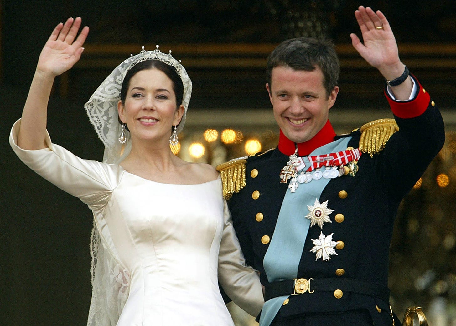 Mary and Frederik wave from the balcony on their wedding day