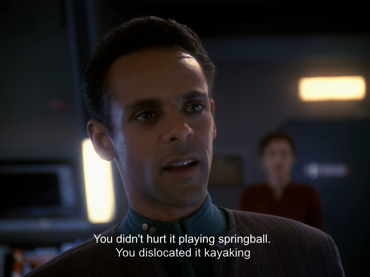 still image from Star Trek: Deep Space Nine, showing Dr. Julian Bashir and the caption "You didn't hurt it playing springball, you dislocated it kayaking"