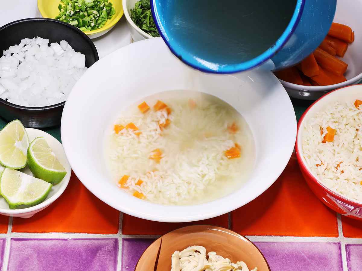 Pouring Chicken Broth over Rice