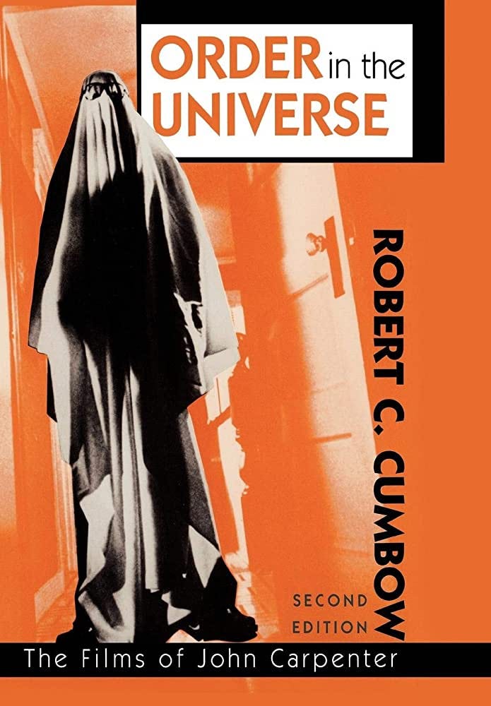 This image shows the book cover of the second edition of Robert C. Cumbow's scholarly monograph Order in the Universe: The Films of John Carpenter, published by Scarecrow Press in the year 2000. This image shows the book cover of the second edition of Robert C. Cumbow's scholarly monograph Order in the Universe: The Films of John Carpenter, published by Scarecrow Press in the year 2000.