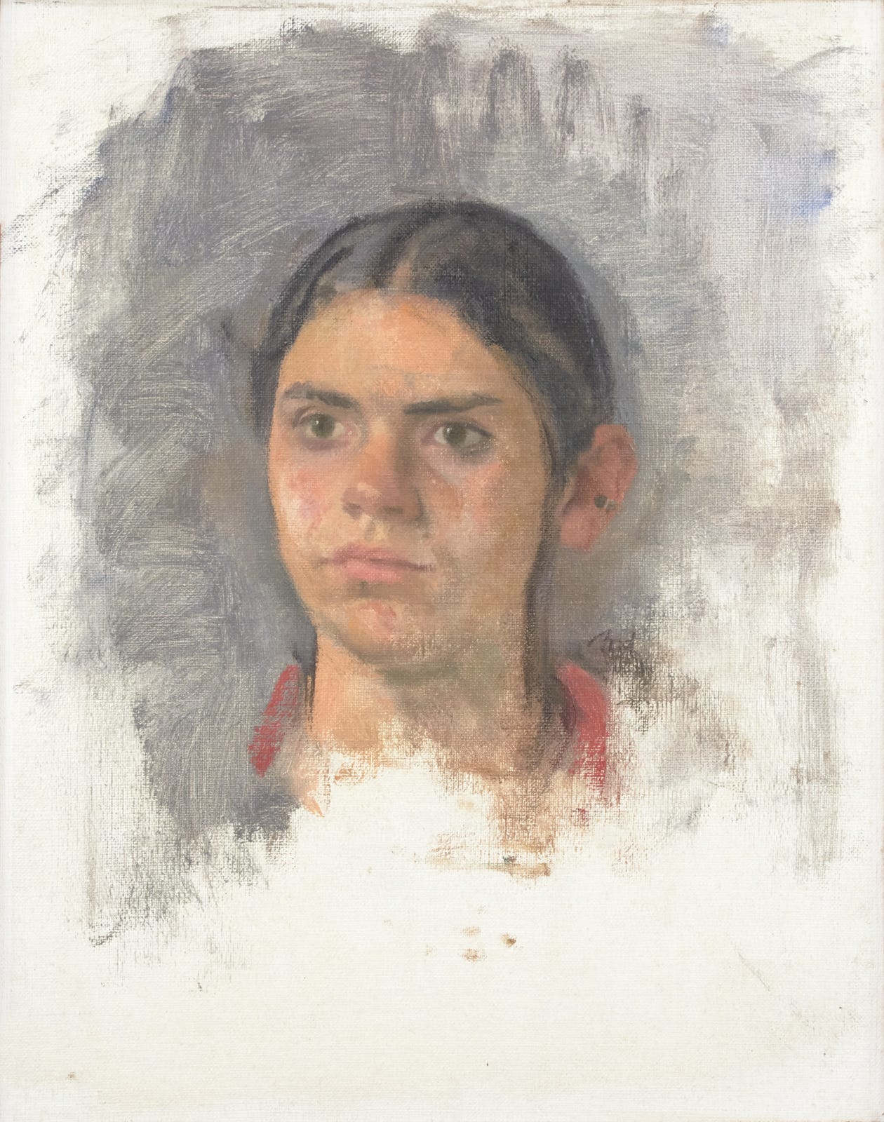 The head of a teenaged girl looking defiant. The head of a teenaged girl looking defiant.
