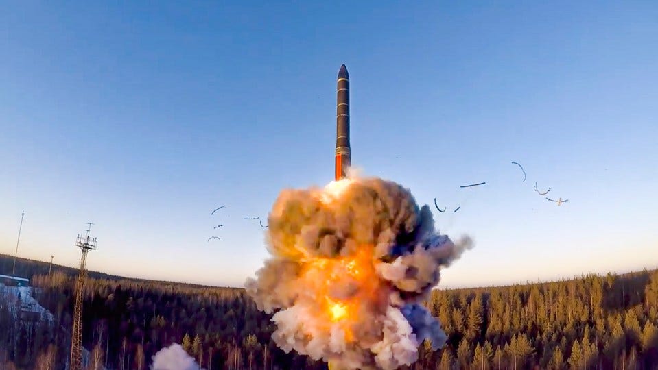 Missile launch with smoke and debris.