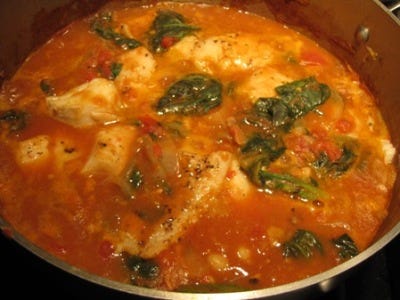 Cod stew with tomatoes, spinach, chickpeas and paprika.