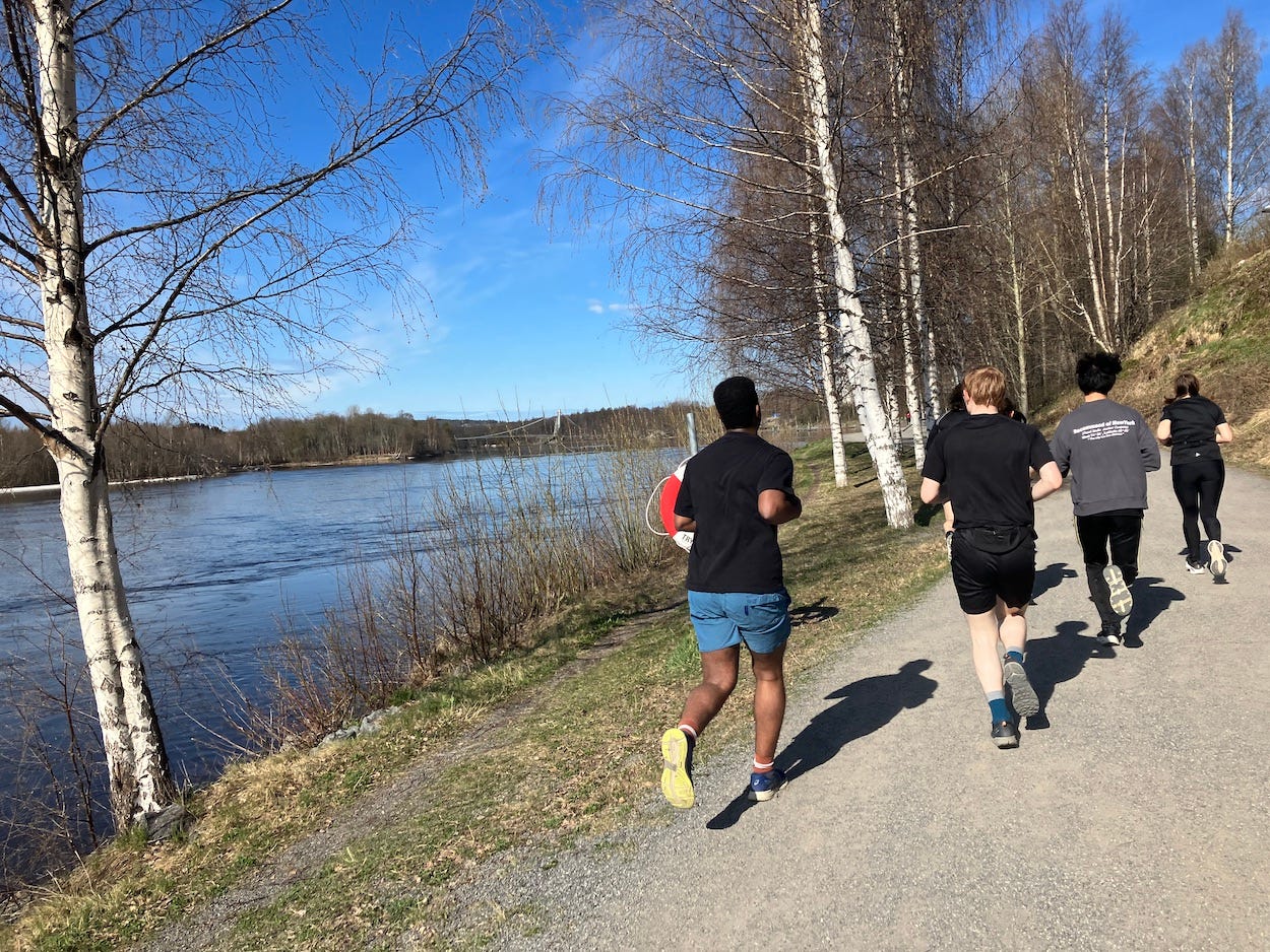 Runners by the river.