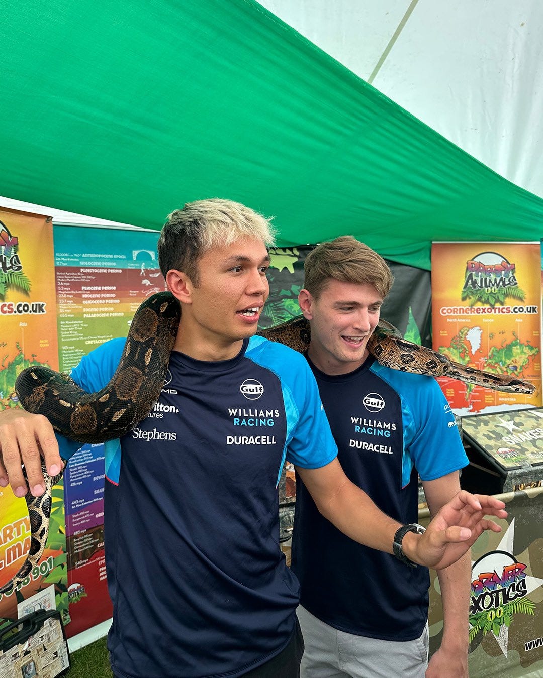 Alex and Logan with a snake on their shoulders