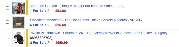 screenshot of a Discogs want list, showing albums by Jonathan Coulton, Streetlight Manifesto, and Weird Al Yankovic