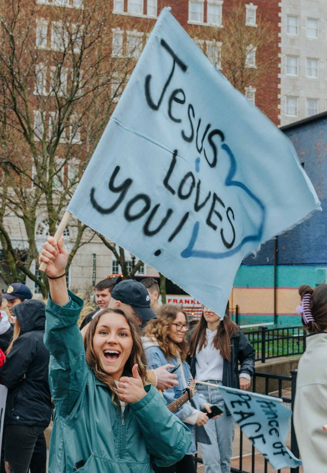 a person holding a sign