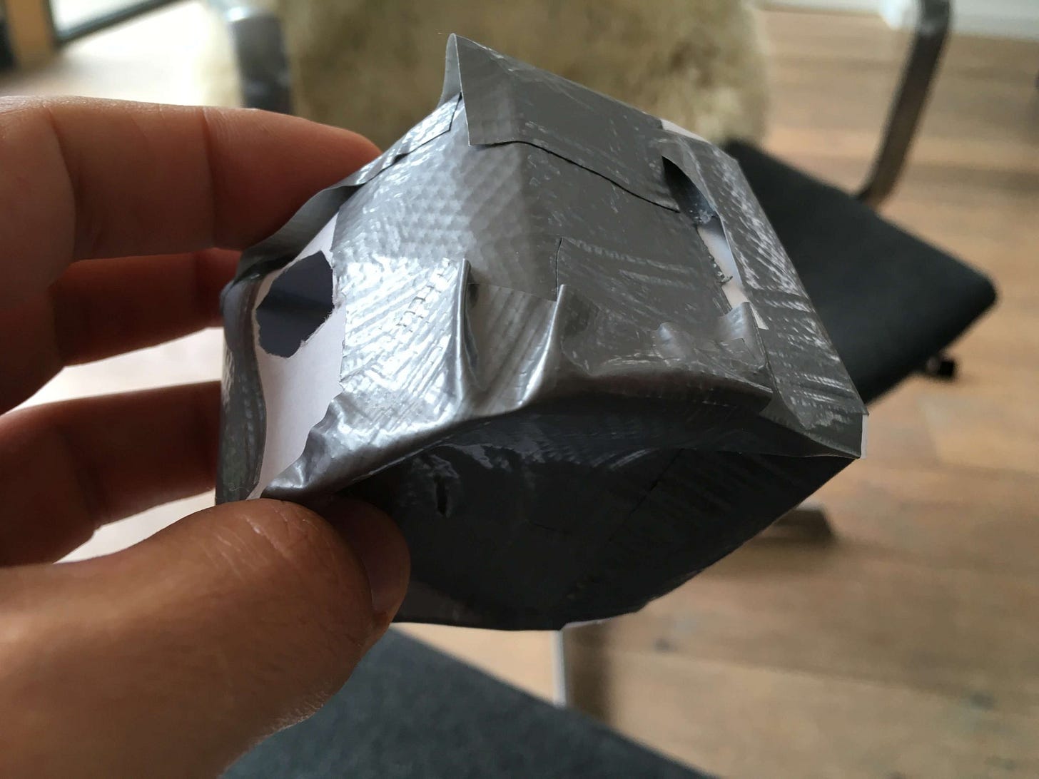 crafted grey cube-like shape