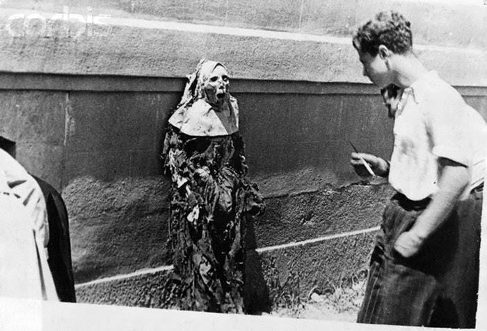 The corpse of a Carmelite nun on public display in Barcelona, Spain, during  the Spanish Civil War, July 1936 [458x690] : r/HistoryPorn