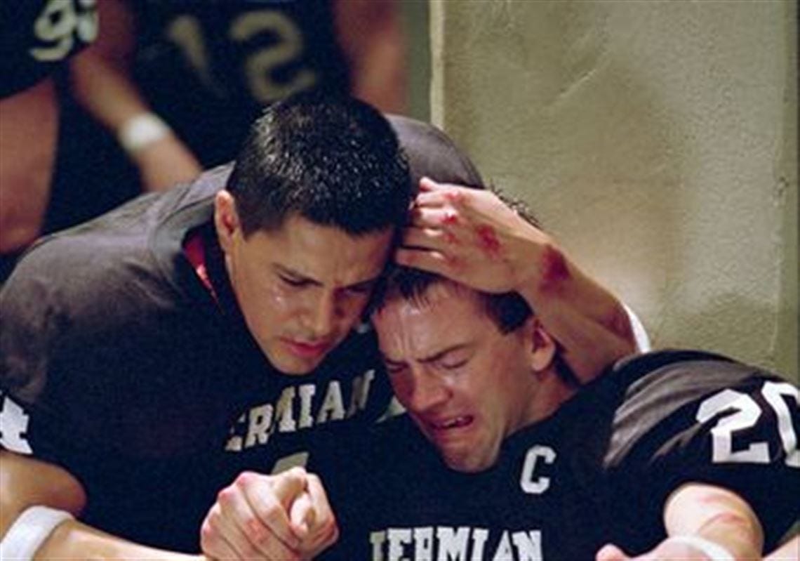 friday night lights lucas black with jay hernandez holding each other